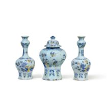 A Dutch Delft or German Fayence Polychrome Three Vase Garniture, Early 18th Century | Eine 3-teilige