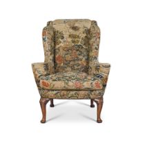 A Queen Anne Walnut Wing Armchair, Circa 1710