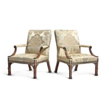 A Pair of George III Upholstered Mahogany Library Armchairs