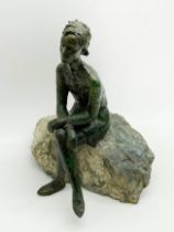 BRONZE FIGURE OF SEATED WOMAN WITH CROSSED LEGS