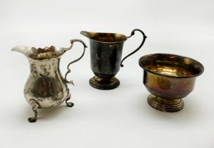 TWO SILVER JUGS WITH A SILVER DISH