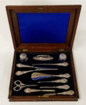 A MAHOGANY BOXED 11 PIECE HM SILVER DRESSING TABLE SET