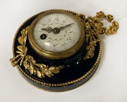 A DECORATIVE WALL HANGING CLOCK (WITH KEY)