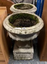 PAIR OF GARDEN URNS ON PLINTH