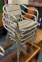 FOUR METAL STACKING CHAIRS