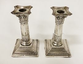 PAIR OF SILVER VINTAGE WEIGHTED CORINTHIAN CANDLESTICKS - 16 CMS (H) APPROX