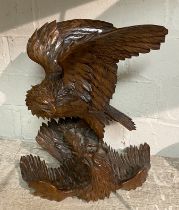 CARVED WALNUT JAPANESE EAGLE FEEDING ITS YOUNG (WING HAS BEEN REGLUED)