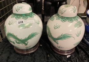 TWO ORIENTAL LIDDED URNS 30CMS (H) APPROX ON BASE