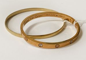 9CT GOLD BANGLE - 11.1 GRAMS WITH A METAL BANGLE