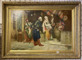 GILT FRAMED OIL ON BOARD OF ARABIC MARKET TRADERS