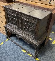 CARVED OAK OTTOMAN