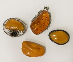 FOUR AMBER BROOCHES