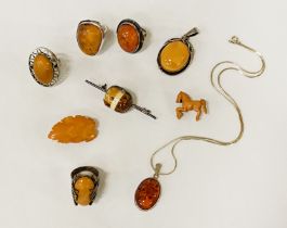 4 AMBER RINGS, AMBER PENDANT ON CHAIN & 4 AMBER BROOCHES