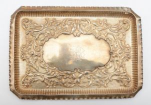 A Victorian silver dressing table tray, Birmingham 1899, with embossed decoration 27 x 19cm, 298gm