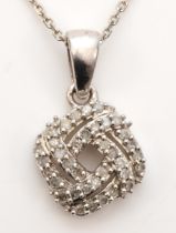 An unmarked white gold diamond cluster pendant, on chain , 18 x 11mm, 3.2gm.