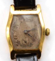 An 18ct gold Art Deco manual wind gentleman's wristwatch, silvered dial, the case with floral