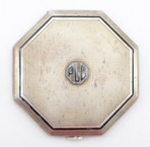 An Art Deco silver compact, London 1933, with applied black enamel PLG monogram, mirror, no powder