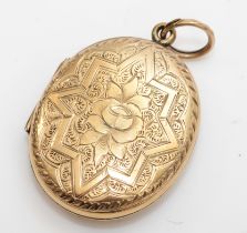An unmarked gold front and backed oval locket, with geometric and foliate chased decoration, 31 x