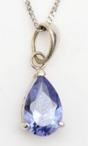 An unmarked white gold blue cubic zirconia drop pendant, on chain, 15mm, 1.3gm.