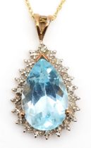 A 9ct gold pear cut blue topaz and diamond cluster pendant, on chain, 24 x 13mm, 3.3gm.