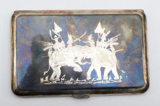 A Siamese silver and niello cigarette case, with war elephants to one side and figures to the other,