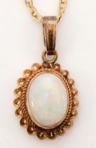 A 9ct gold opal pendant, on chain, flashes of red, green and blue, 12 x 9mm, 1.3gm.