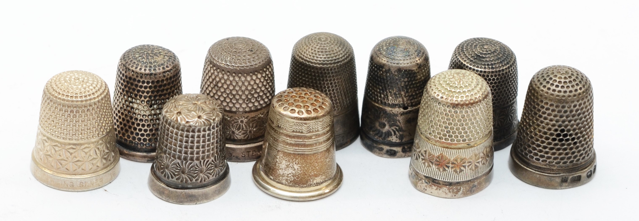 A Victorian silver thimble, by Charles Horner, Chester 1899 another 1901 and eight other silver/
