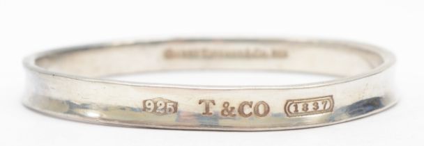 Tiffany & Co, a silver concave bangle, 62 x 59mm, 34gm.