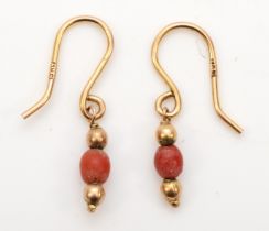 A pair of 9kt gold coral drop earrings, 22mm, 0.7gm.