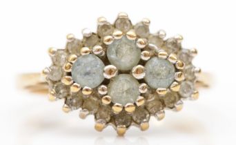 A 9ct gold blue topaz and diamond cluster ring, J-K, 2.6gm.
