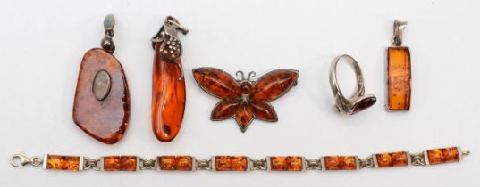 A group of silver Baltic amber jewellery to include pendants, a bracelet and a ring O, 28gm.