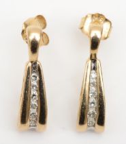 A pair of 9k gold channel set brilliant cut diamond drop earrings, 17mm, 1.4gm.