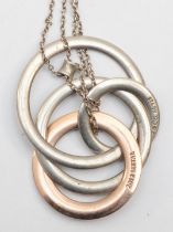 Tiffany & Co, a silver and gold plated hooped pendant on chain, 13gm.