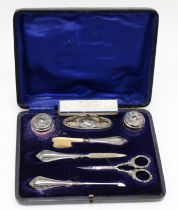 An Edwardian silver nail set, Birmingham 1906/07, cased together with a silver and mother of pearl