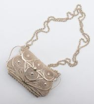 An unmarked silver filigree purse, with belcher link chain, 10 x 5.5 x 3cm, 150gm