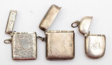 A Victorian plain silver vesta case Birmingham 1895, another the same date and an Edwardian