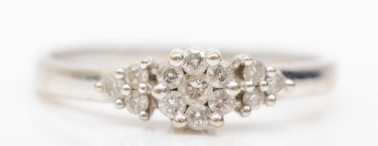 A 9k white gold brilliant cut diamond cluster ring, P, 1.7gm.