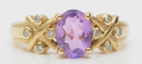A 9ct gold amethyst and diamond dress ring, N, 3.8gm.
