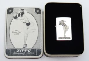 Zippo, a collectors petrol lighter, 1935 Varga Girl, unused, in tin with paperwork dated 1994.