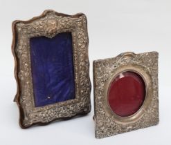 A Victorian silver photograph frame, Chester 1900, with embossed and pierced floral scroll frame, 22