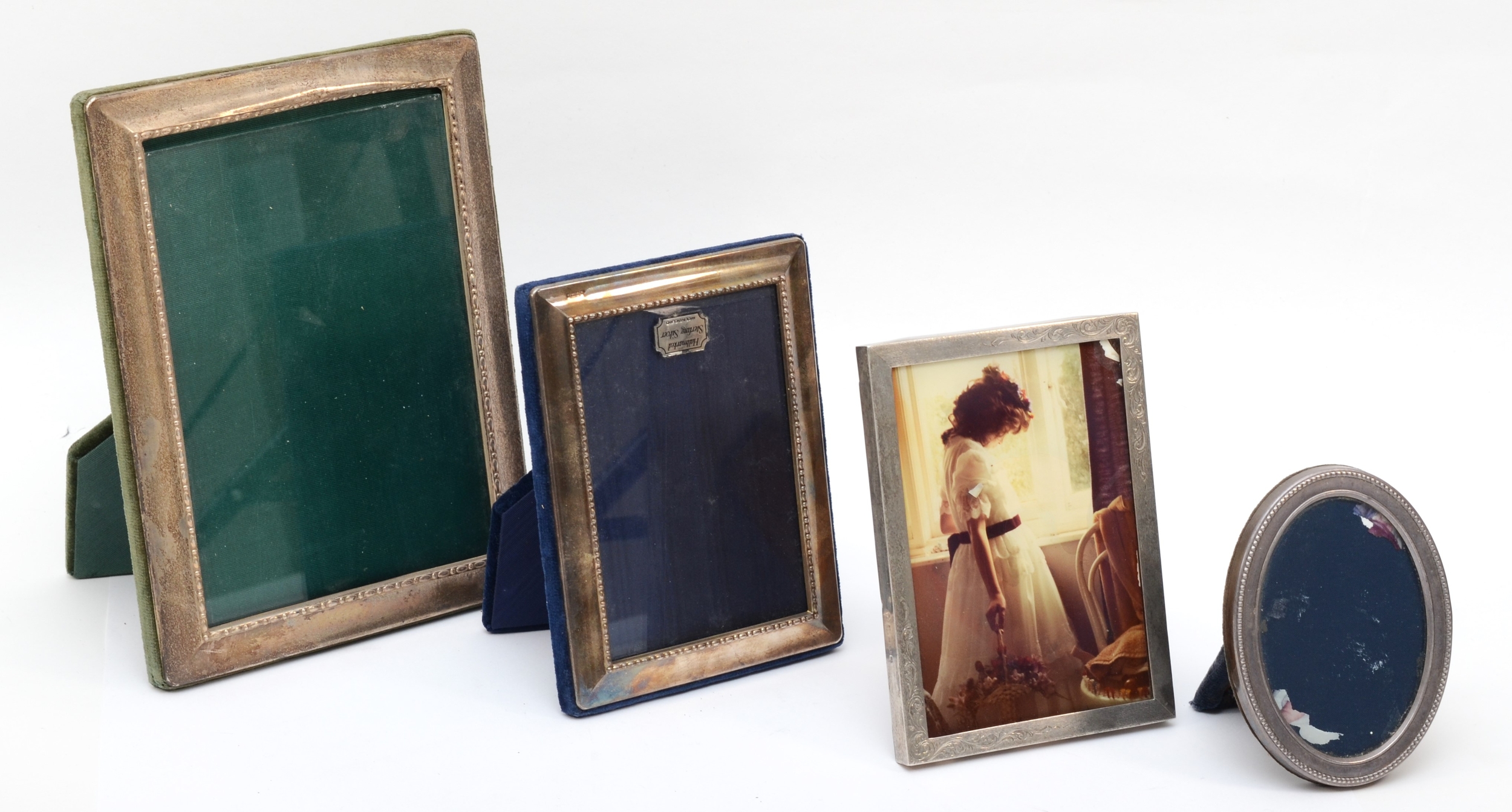 A silver photograph frame, Sheffield 1993, 21 x 15,5cm and three other silver photograph frames of