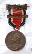 A London County Council Kings Medal with 1911-12 clasp, awarded to M. Brennan, a 1925 British Empire