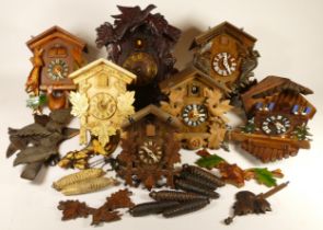 A collection of mid 20th century cuckoo clocks, for spares or repair.