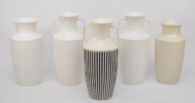 Two pairs of Hornsea cream fluted urn shaped vases, together with a studio craft example, 27cm tall.
