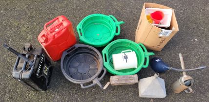 Two Jerry cans, oil pans and jugs.