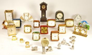 A collection of mid 20th century and later mantel clocks and traveling alarm clocks, having manual