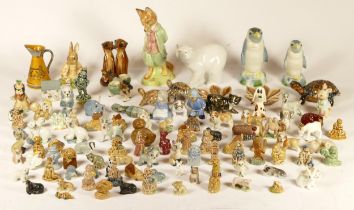 A collection of porcelain figures, to include Wade Whimsies, Rowan studio models, and Royal Albert