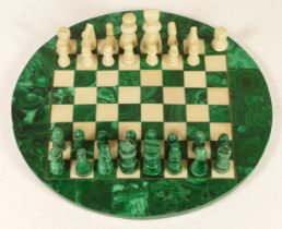 A miniature chess set, having malachite chess pieces & board.