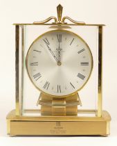 A 20th century brass cased Kundo electronic mantle clock, 23cm high.