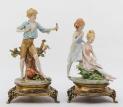 Two 20th century Capodimonte painted porcelain figures, two females reading a book and a boy with